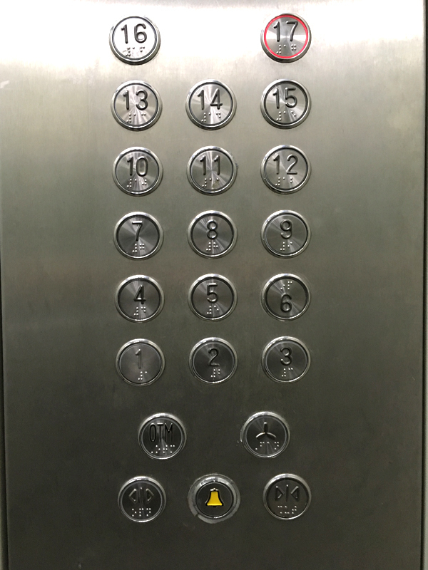 Modern elevators with extended doorways, Braille buttons, and sound effects.